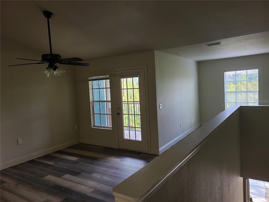 8911 Manor Loop, Unit 205 Lakewood Ranch, FL 34202 - Photo 30 of 33 a view of a room window and wooden floor