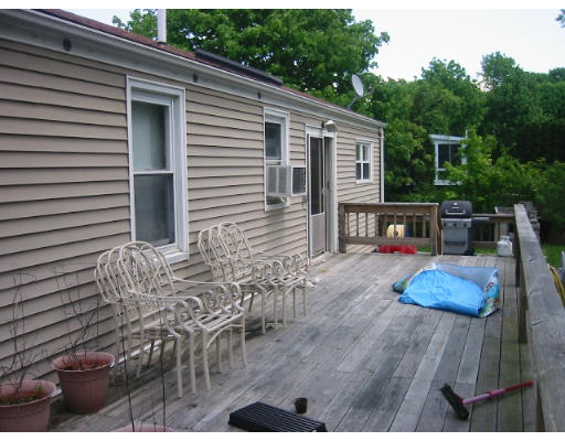 65 Hambly Road Tiverton, RI 02878 - Photo 3 of 6 a view of house with backyard outdoor seating and wooden floor