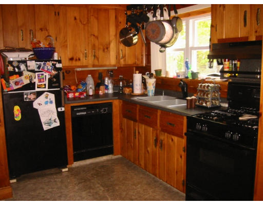65 Hambly Road Tiverton, RI 02878 - Photo 4 of 6 a kitchen with stainless steel appliances granite countertop a stove a refrigerator and a sink