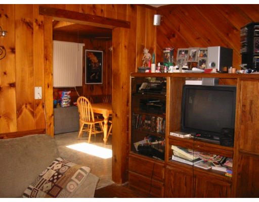 65 Hambly Road Tiverton, RI 02878 - Photo 6 of 6 a dining area with a table and chairs in front of it