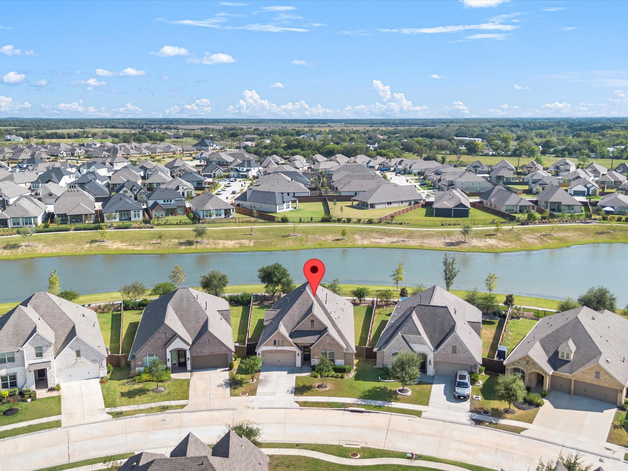 Welcome to 10135 Napier Drive in the beautiful master-planned community of Meridiana!This stunning Perry Home was built in 2021, showcasing timeless curb appeal and elegant architectural details.
The covered front entry with upgraded brick and stone elevation creates a warm first impression.