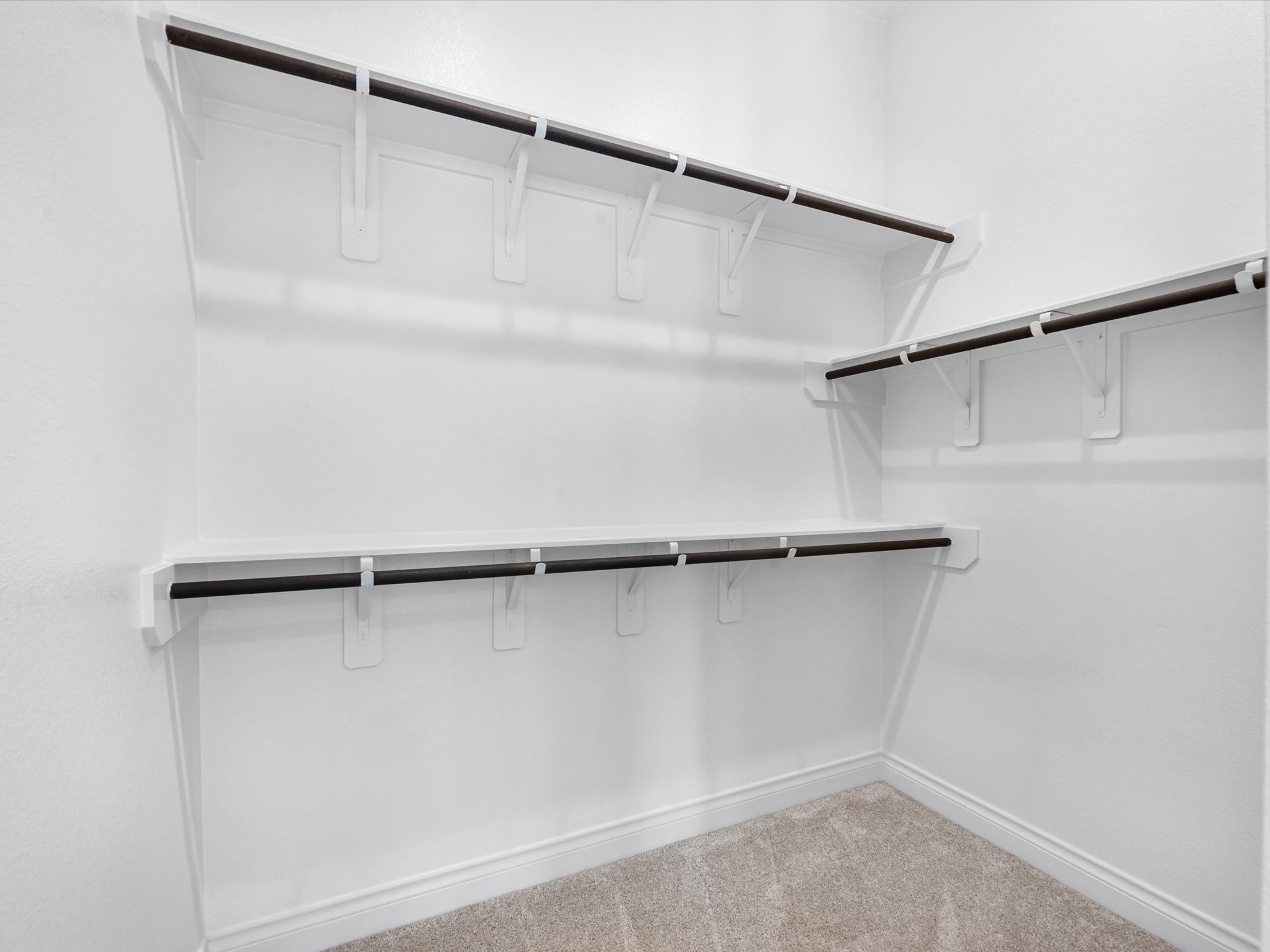 10135 Napier Drive Rosharon, TX 77583 - Photo 15 of 36 The secondary closet (his) in the primary suite.