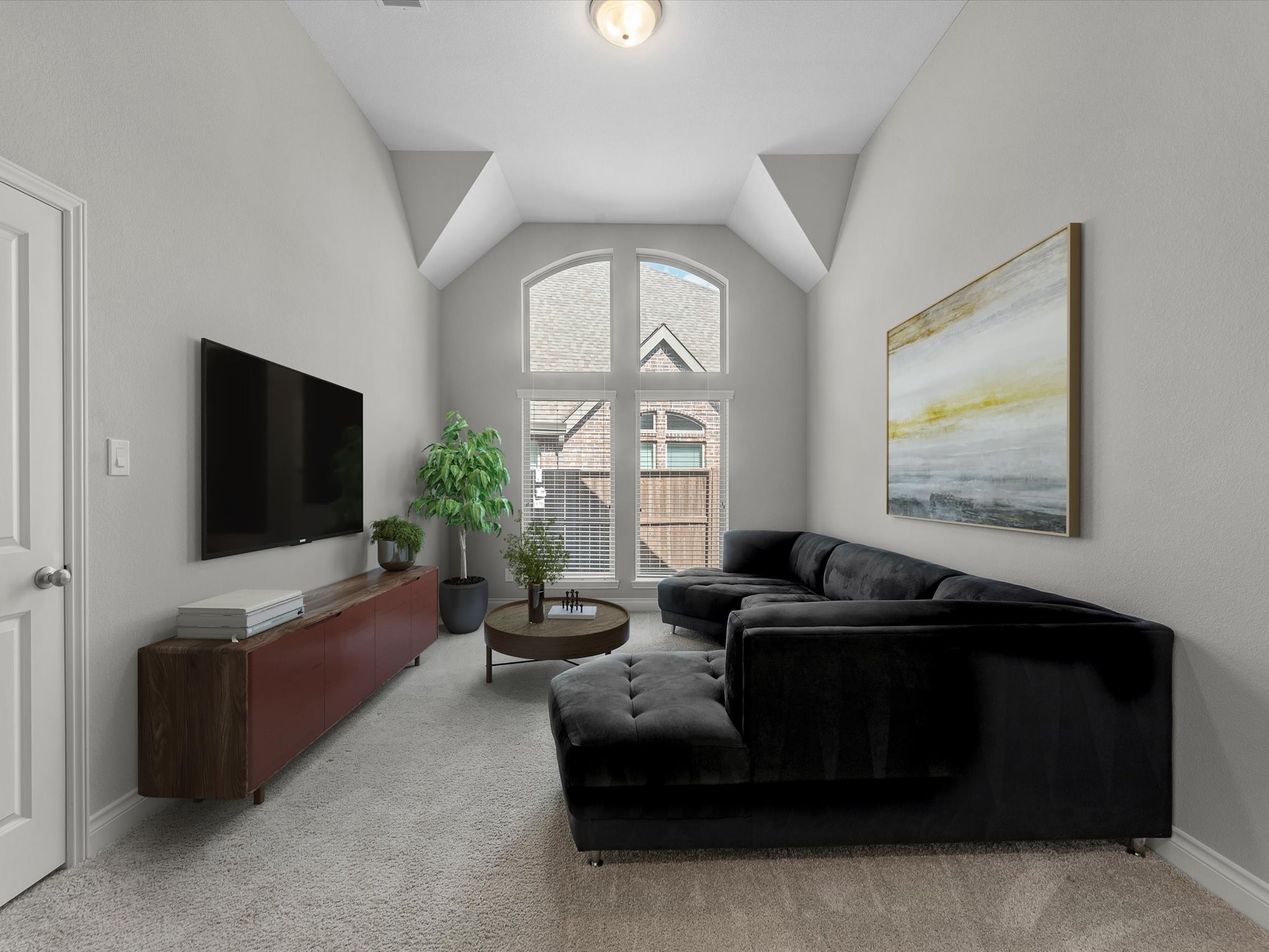 10135 Napier Drive Rosharon, TX 77583 - Photo 17 of 36 The oversized flex space can easily accommodate a large sectional and TV, as shown, or serve as a formal dining room or home office. Double doors allow the room to be closed off for privacy while still letting natural light flow through. *some elements are virtually staged*