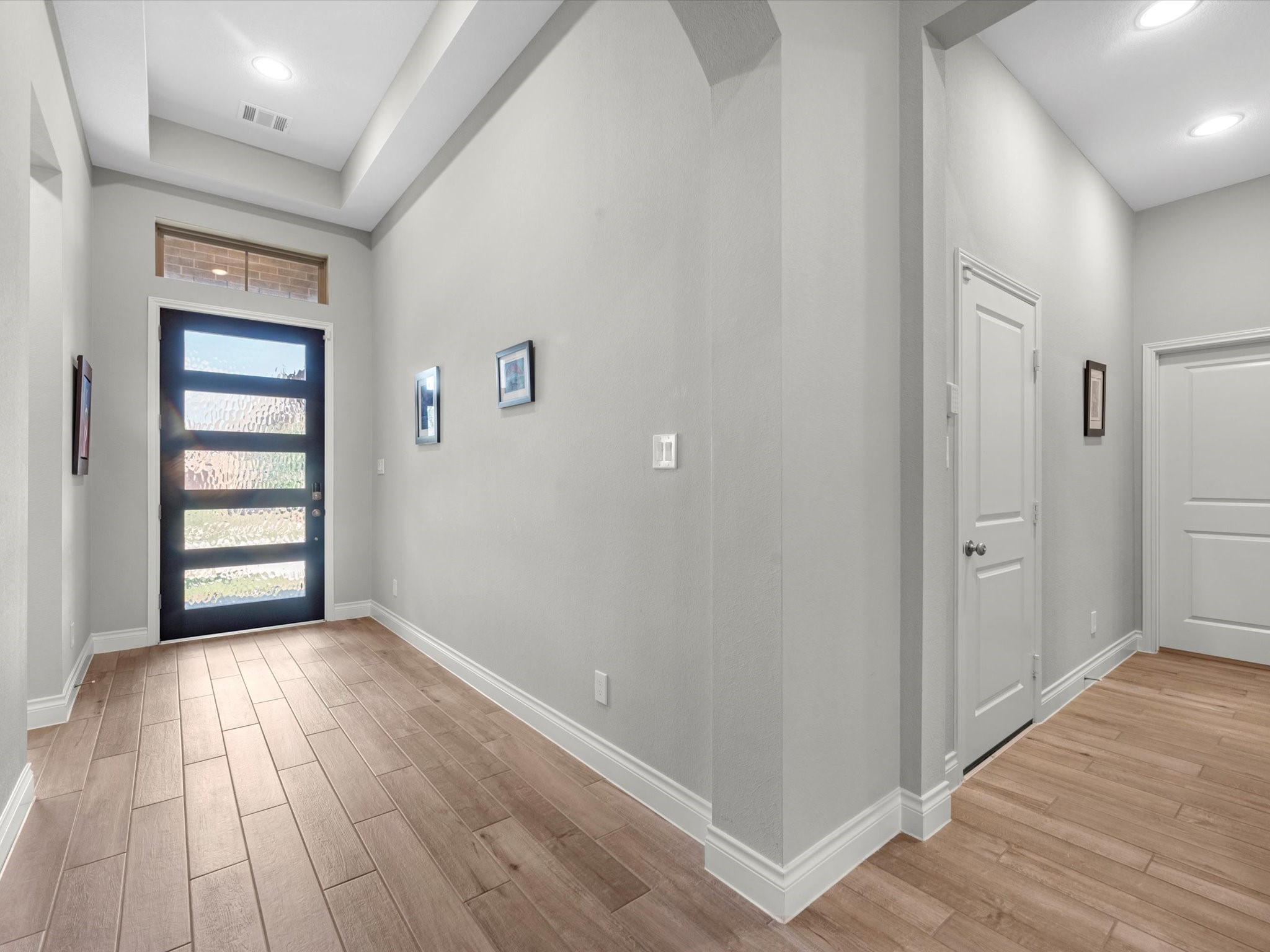 10135 Napier Drive Rosharon, TX 77583 - Photo 23 of 36 Upon entry, there are two bedrooms and a full bathroom to the right. To the left is the entrance to the garage, powder room and laundry room.