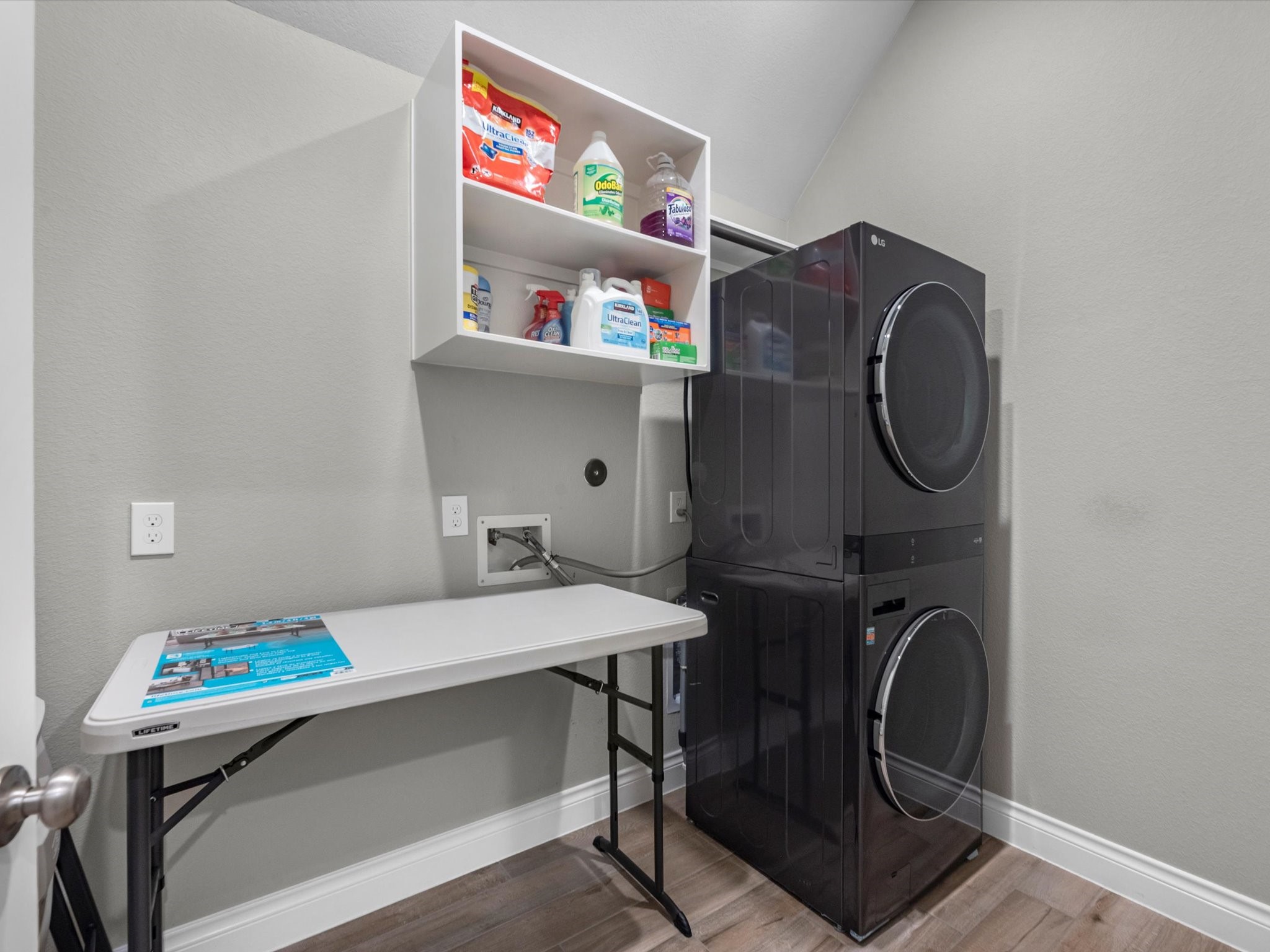 10135 Napier Drive Rosharon, TX 77583 - Photo 25 of 36 Oversized laundry room with built-in shelving and room for storage or an additional fridge.