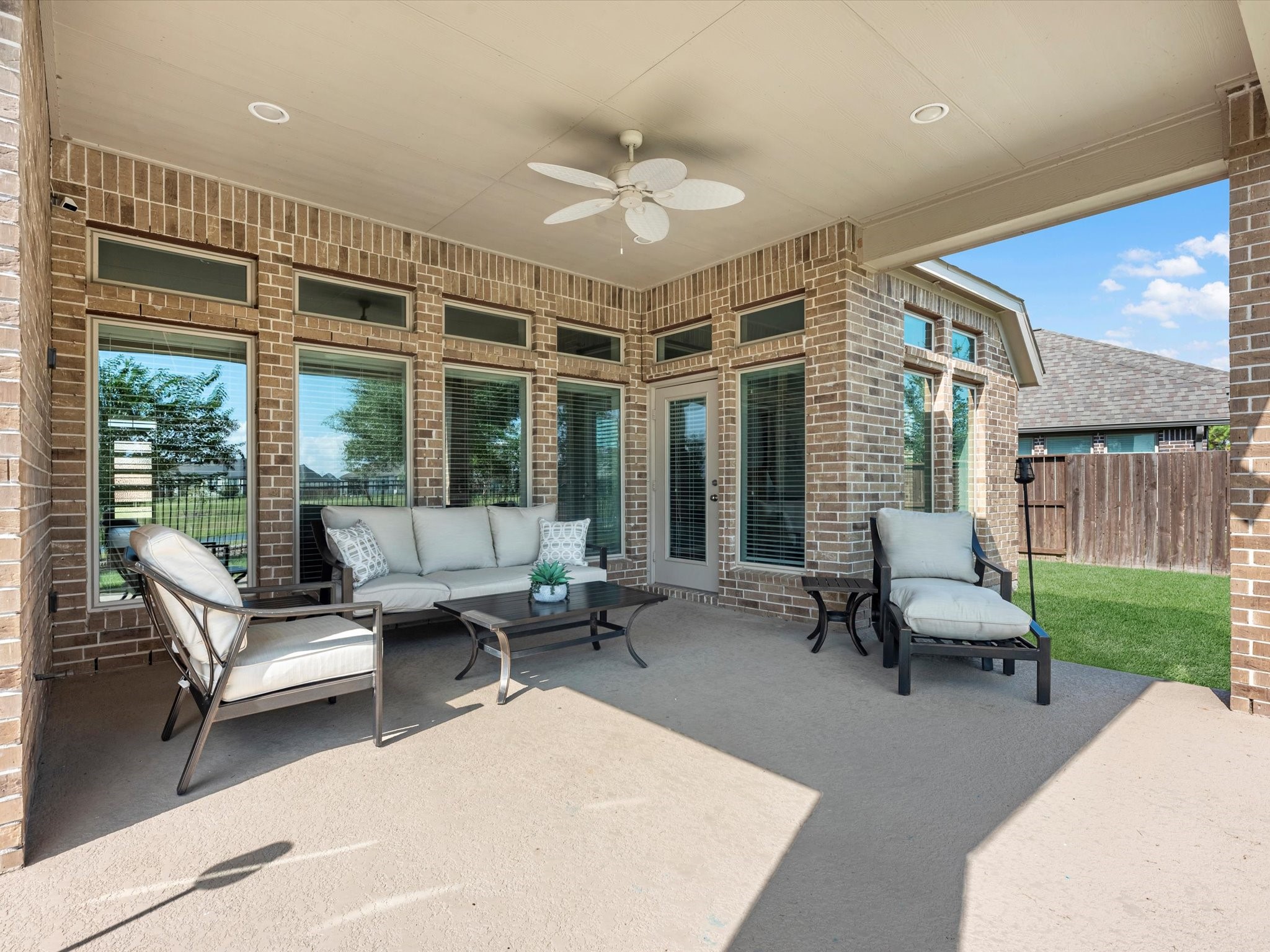 10135 Napier Drive Rosharon, TX 77583 - Photo 26 of 36 Enjoy evenings outdoors under the covered patio, complete with a gas line—perfect for a future outdoor kitchen—as well as electrical outlets for added convenience.
