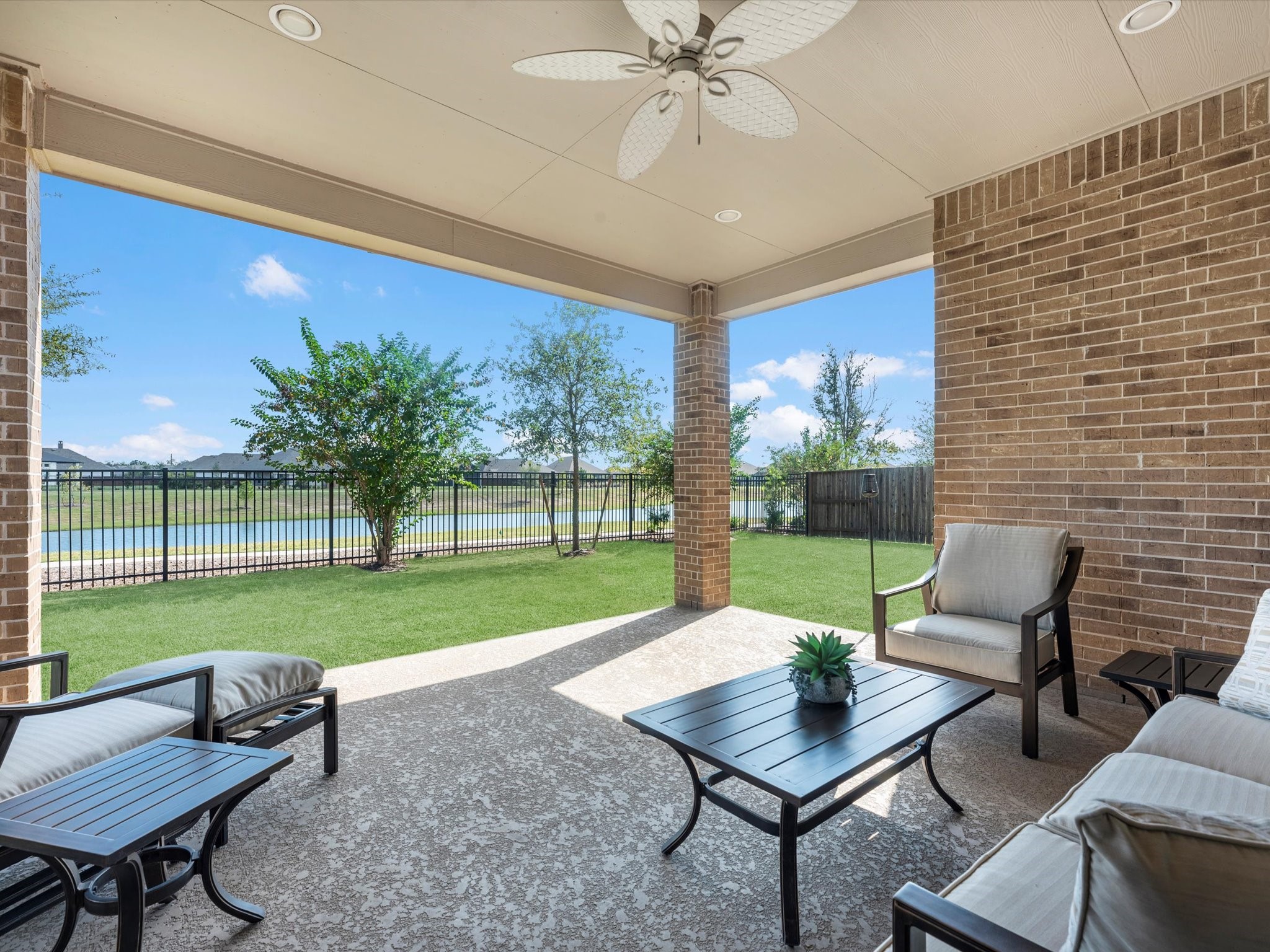10135 Napier Drive Rosharon, TX 77583 - Photo 3 of 36 Enjoy breathtaking sunsets from your large covered patio overlooking the water with serene southern exposure. Start your day with a morning coffee or unwind in the evening with a glass of wine in your private oasis.