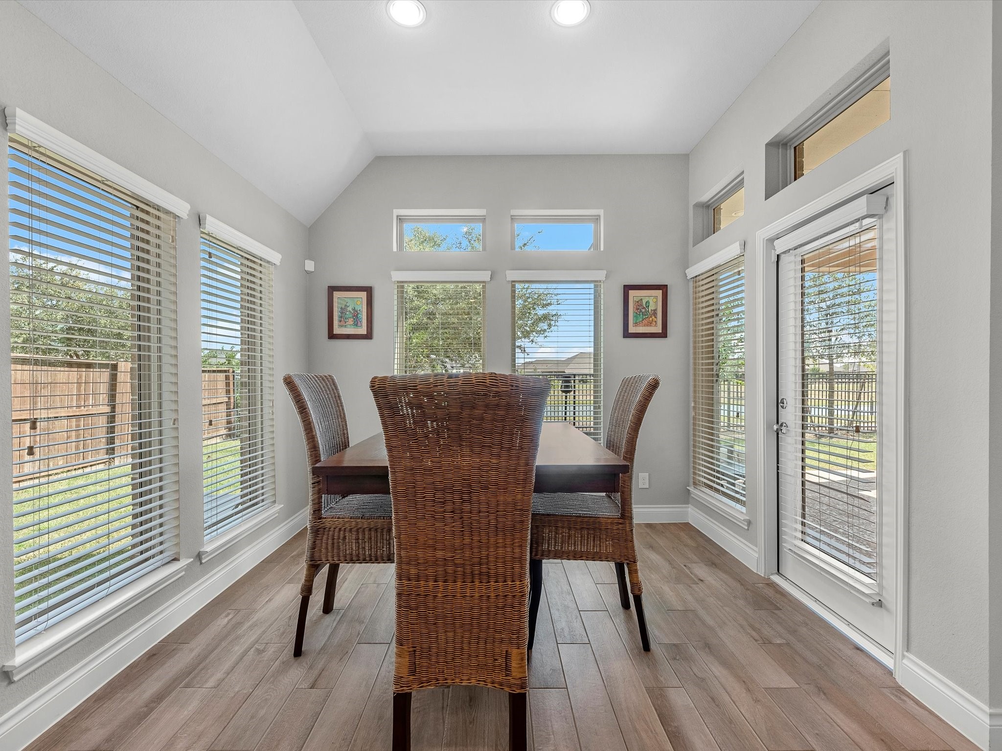 10135 Napier Drive Rosharon, TX 77583 - Photo 9 of 36 The breakfast nook offers tranquil views of the backyard and water beyond, creating the perfect setting to start or end your day.