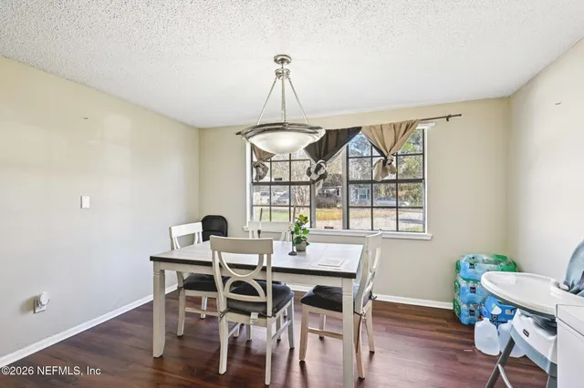 a view of a dining room with furniture window and outside view