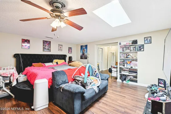 a bedroom with furniture and a bed