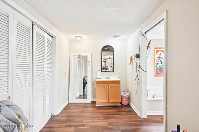 a view of an entryway with wooden floor