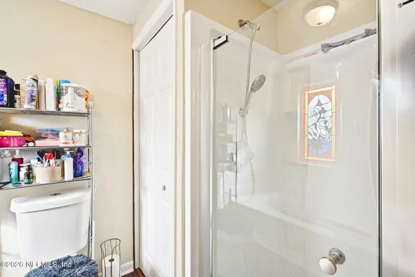 a bathroom with a shower curtain and a sink