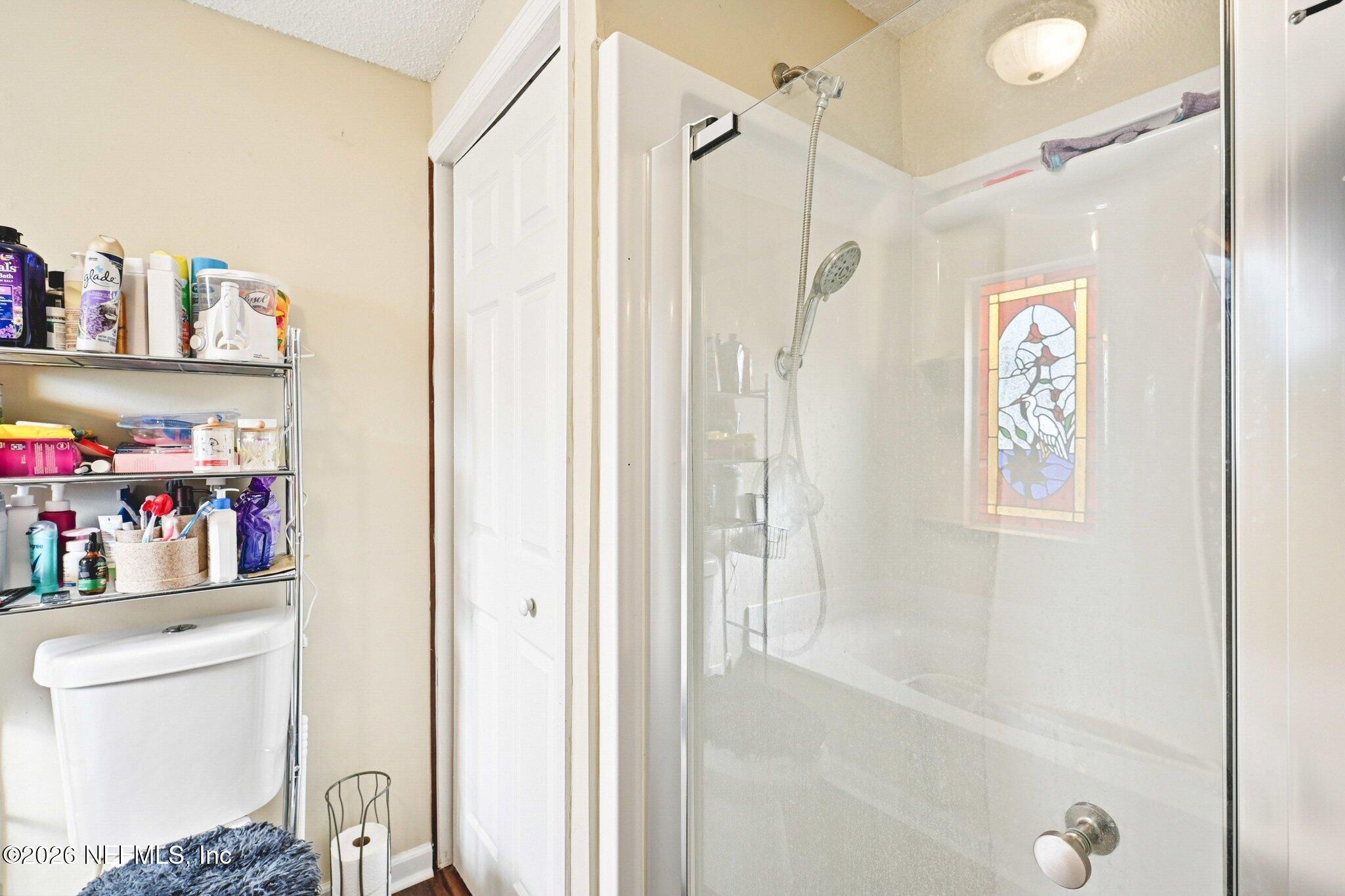 2914 Carleon Road Jacksonville, FL 32218 - Photo 26 of 39 a bathroom with a shower curtain and a sink