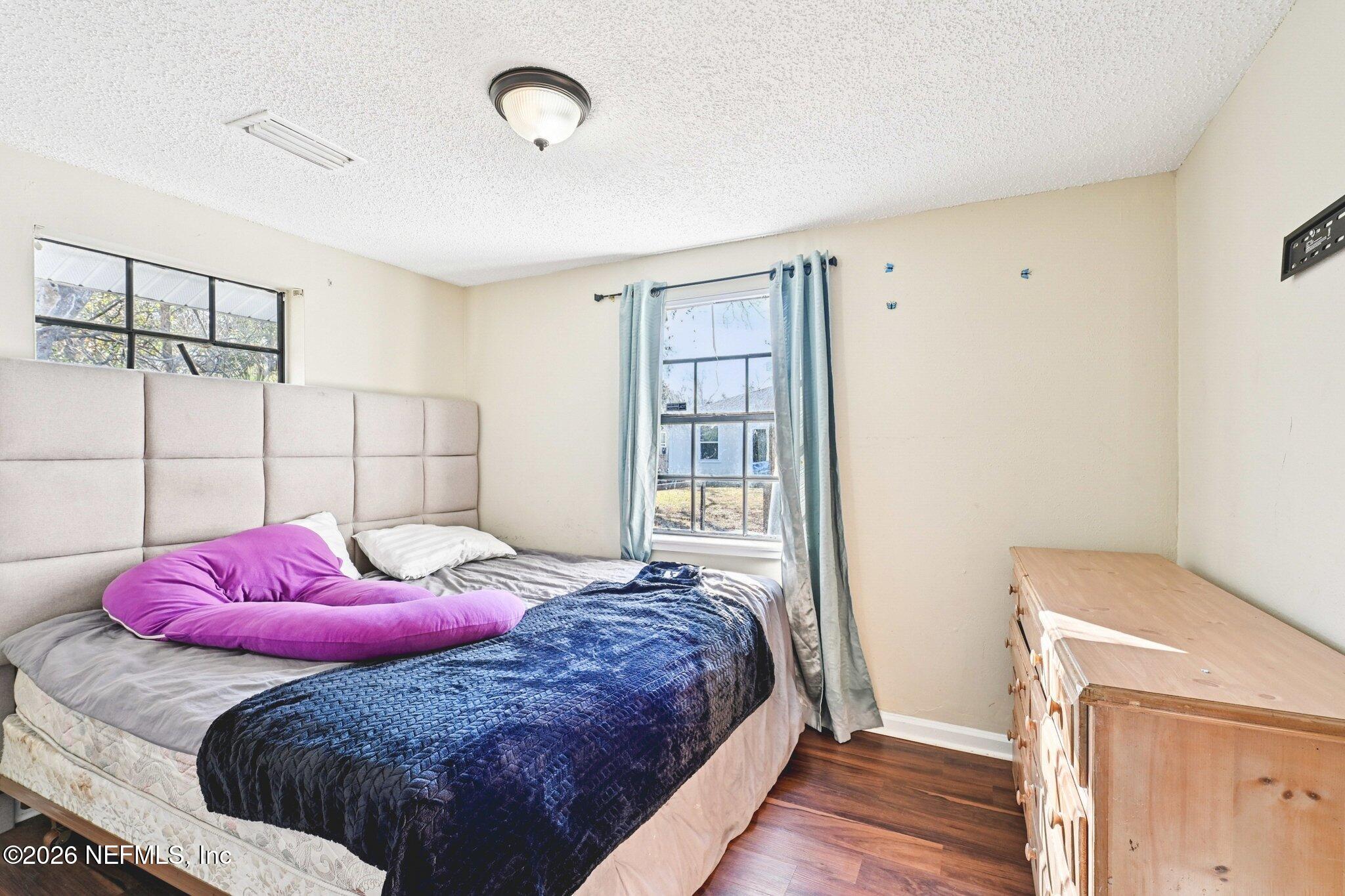 2914 Carleon Road Jacksonville, FL 32218 - Photo 30 of 39 a bedroom with a bed and a window