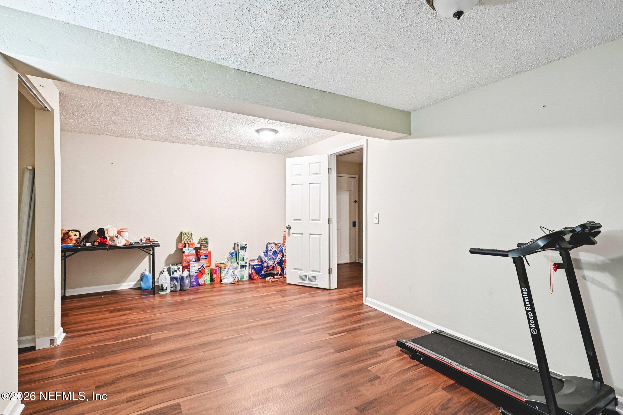 2914 Carleon Road Jacksonville, FL 32218 - Photo 35 of 39 a view of a room with wooden floor and equipment