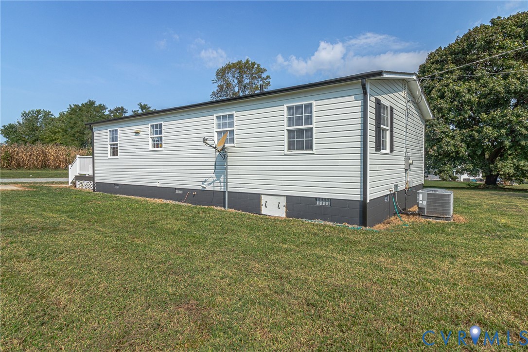 36 Bundick Road Lottsburg, VA 22511 - Photo 37 of 50 White horizontal siding exterior with black founda