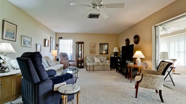 a dining room with furniture and window
