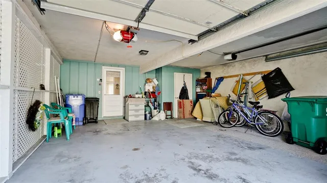 a view of a house with a yard and tree s