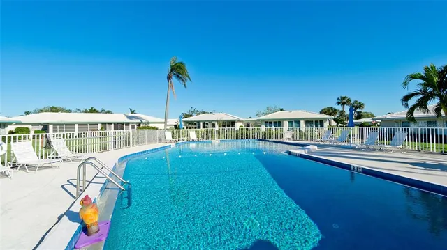 a view of a house with swimming pool yard and patio