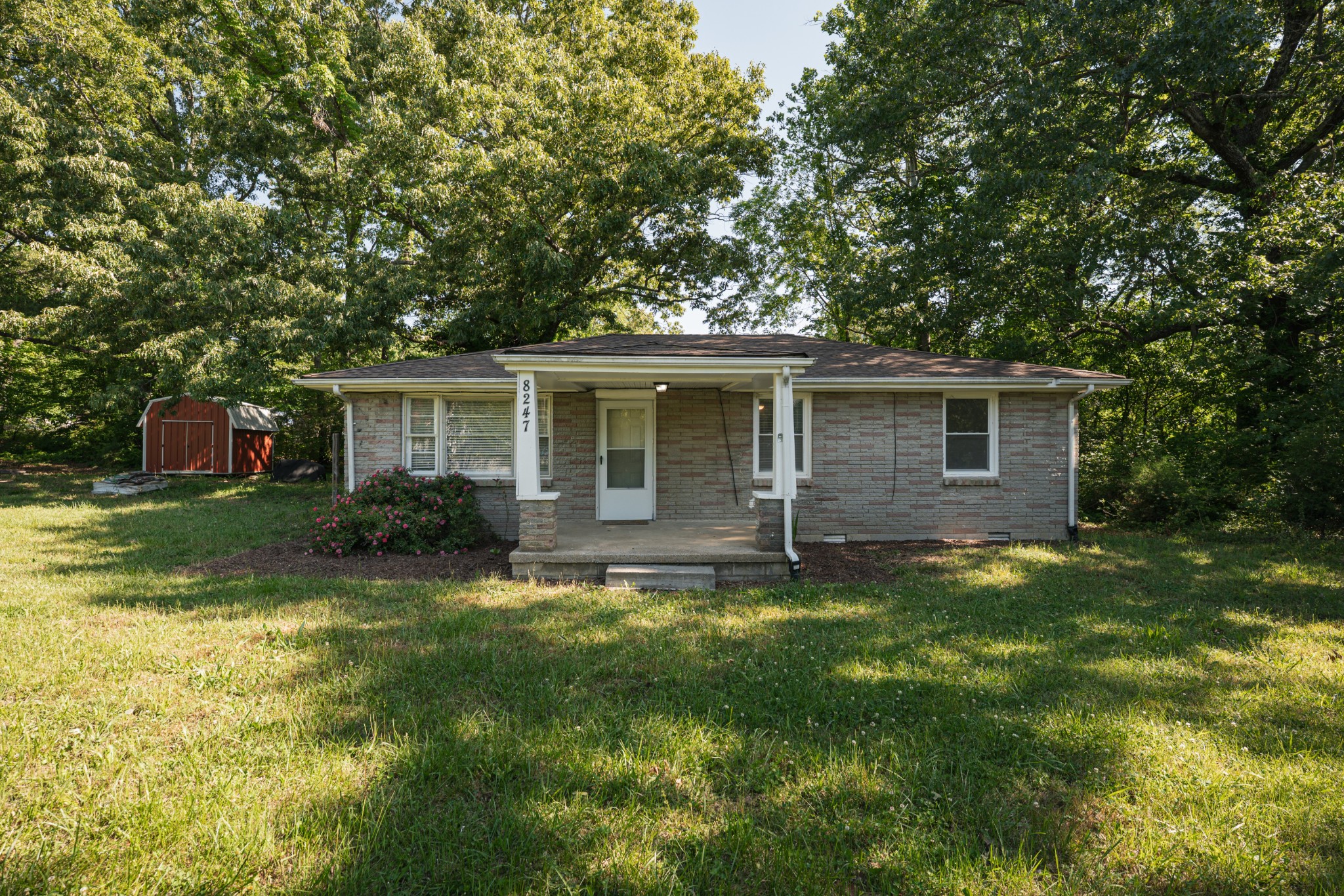 8247 Pinewood Road Nunnelly, TN 37137 - Photo 2 of 14 a view of a house with a yard