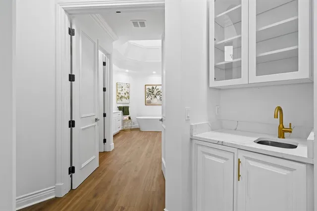 a bathroom with a granite countertop toilet a sink and a mirror