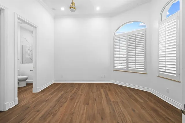 a view of a swimming pool with a garden and lake view