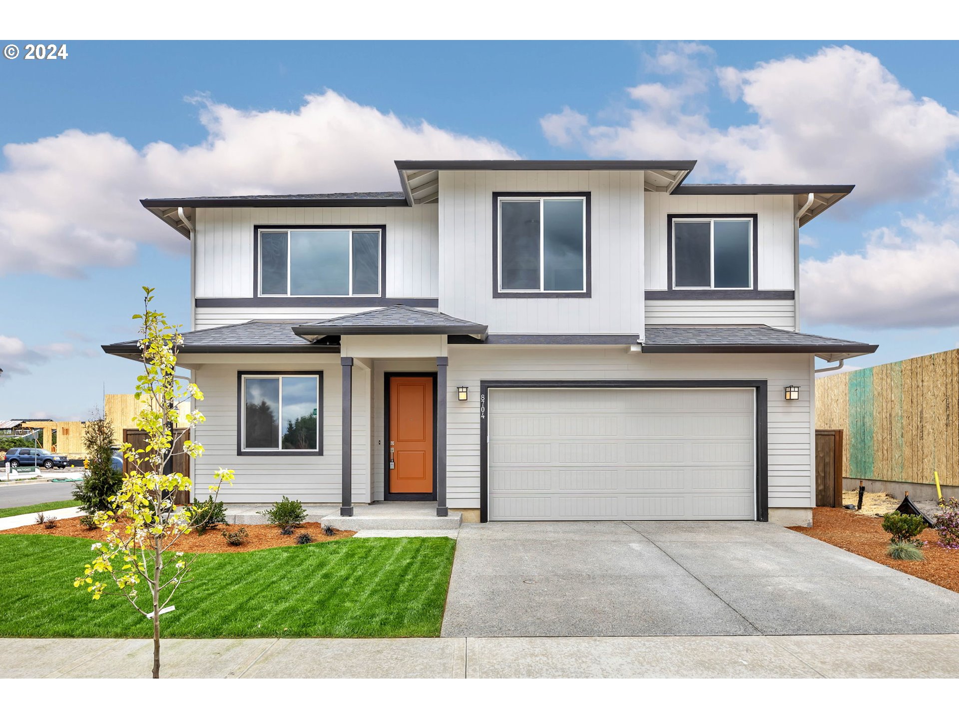 8704 North 3rd Street, Unit 59 Ridgefield, WA 98642 - Photo 1 of 33 a house view with a garden space