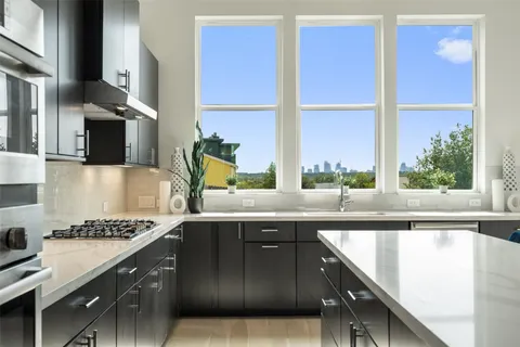 a kitchen with a sink and a window