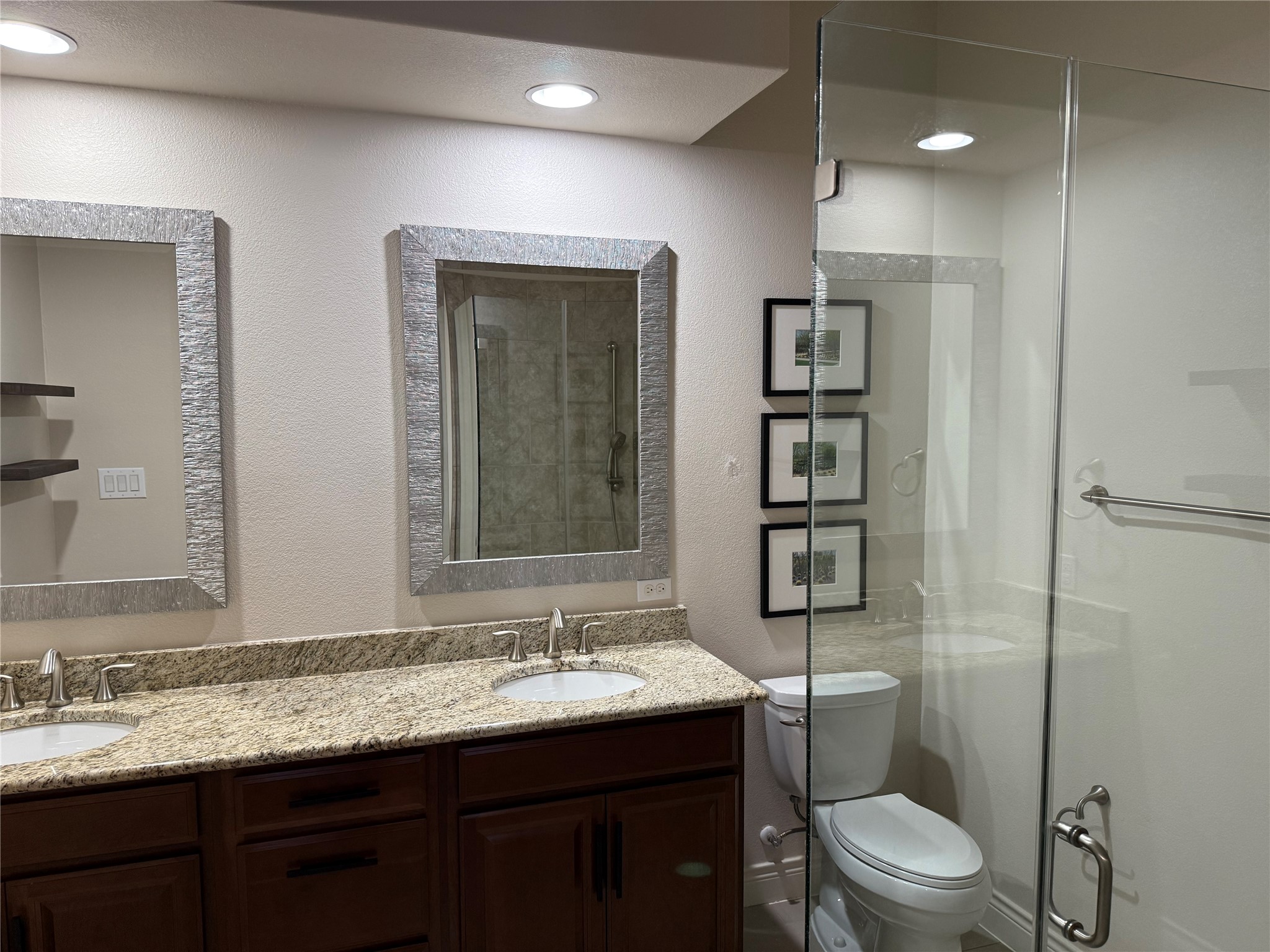 108-2 Rivalto Circle, Unit C3 Lakeway, TX 78734 - Photo 15 of 35 a bathroom with double vanity sink a mirror and a toilet