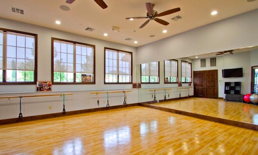 108-2 Rivalto Circle, Unit C3 Lakeway, TX 78734 - Photo 22 of 35 a large white kitchen with stainless steel appliances granite countertop a sink and cabinets