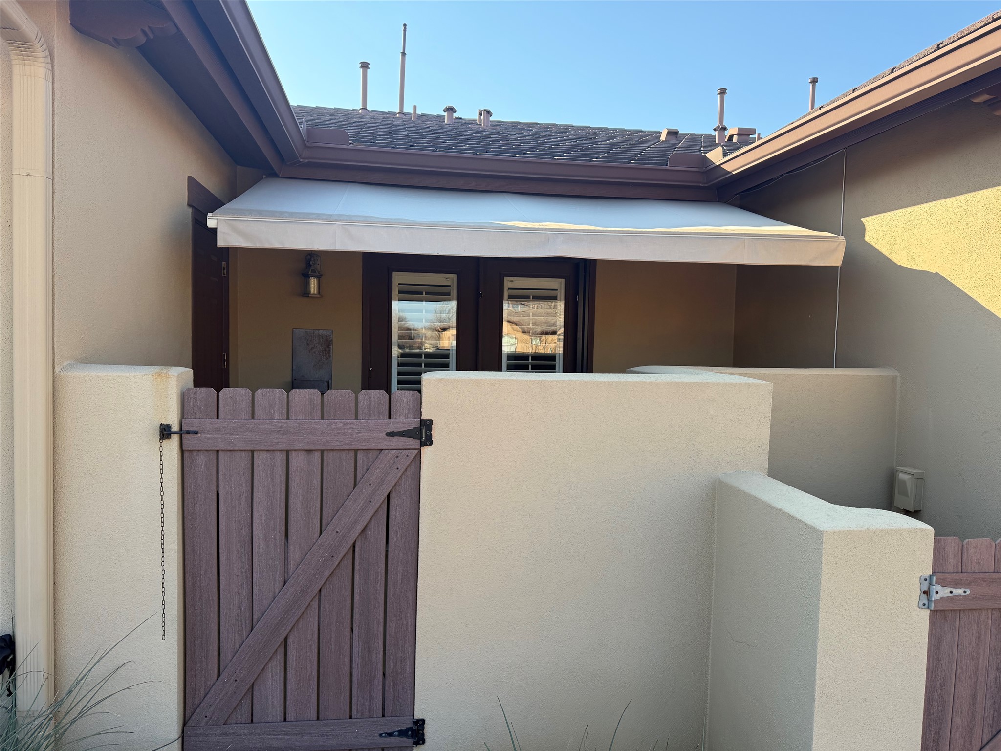 108-2 Rivalto Circle, Unit C3 Lakeway, TX 78734 - Photo 30 of 35 a view of a house with wooden fence