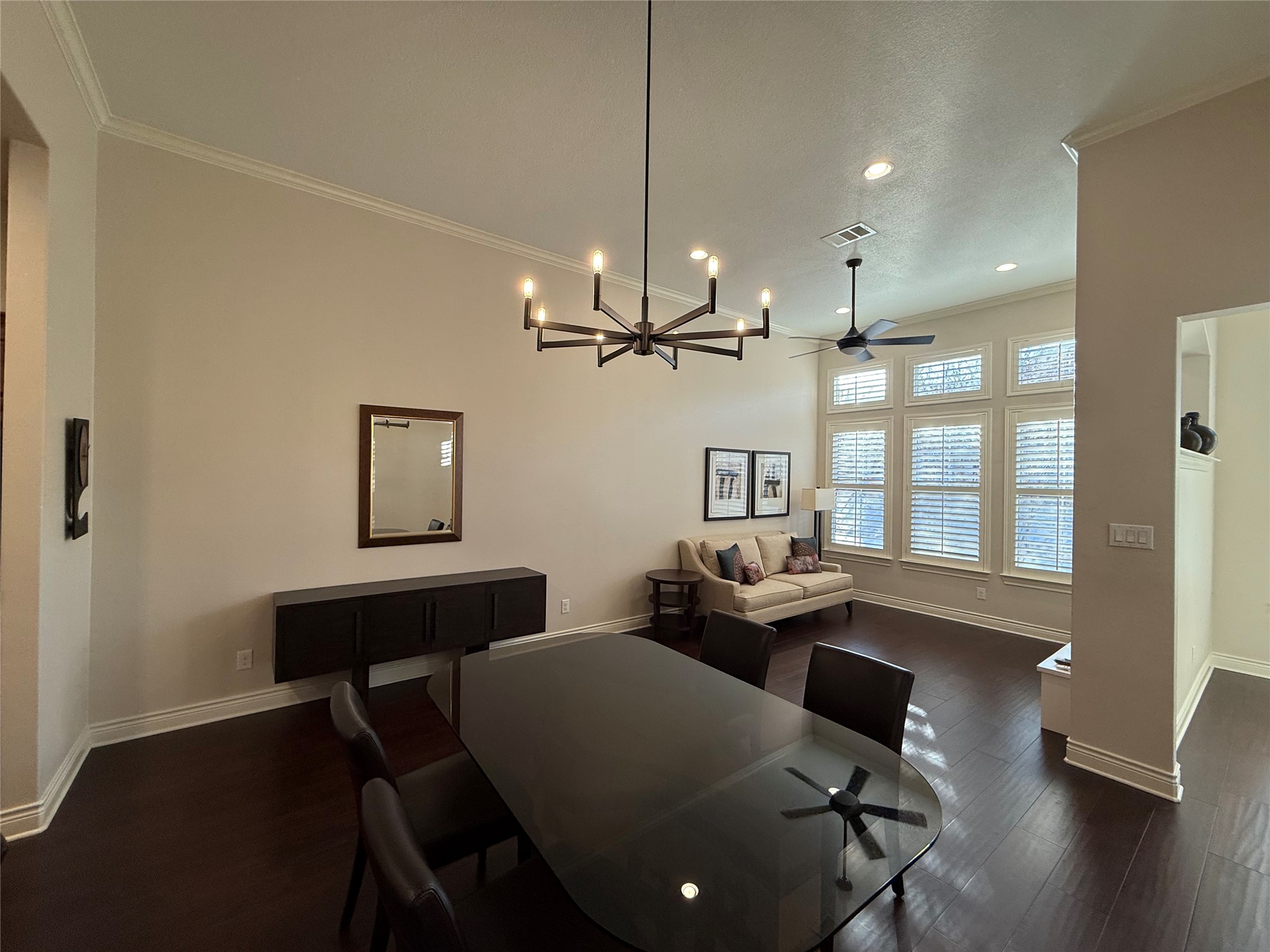 108-2 Rivalto Circle, Unit C3 Lakeway, TX 78734 - Photo 8 of 35 a view of a dining room with furniture window and wooden floor