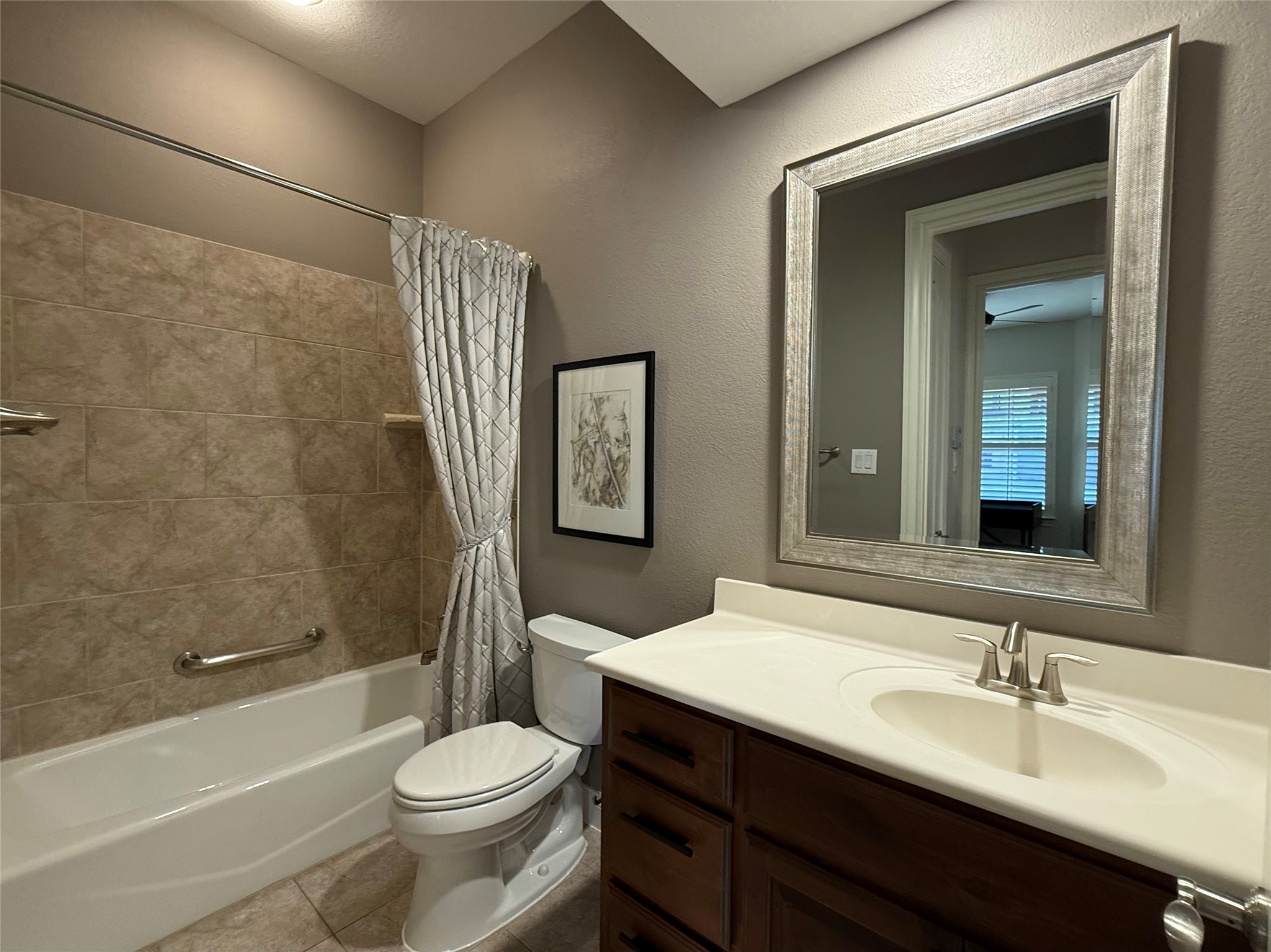 108-2 Rivalto Circle, Unit C3 Lakeway, TX 78734 - Photo 9 of 35 a bathroom with a sink a toilet and shower