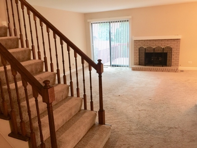 1128 Leicester Court Wheaton, IL 60189 - Photo 6 of 7 a view of staircase with railing and white walls