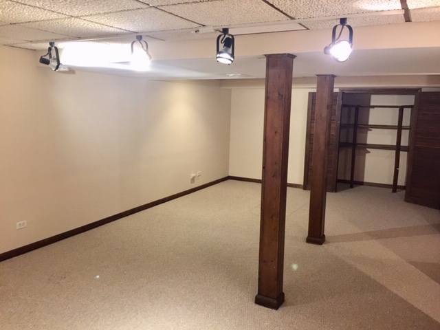 1128 Leicester Court Wheaton, IL 60189 - Photo 7 of 7 a view of a room with rack on the wall