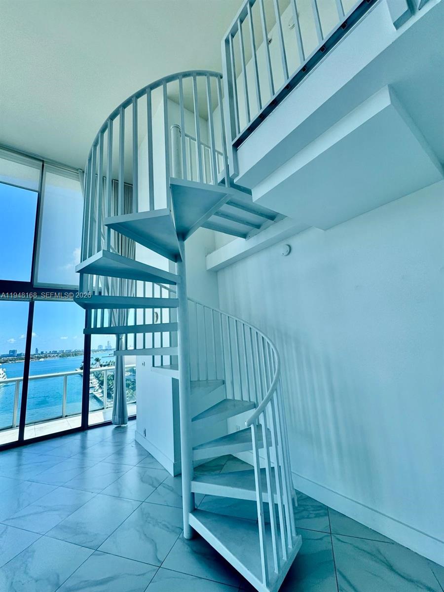 888 Biscayne Boulevard, Unit 906 Miami, FL 33132 - Photo 4 of 19 a view of entryway with a wooden floor