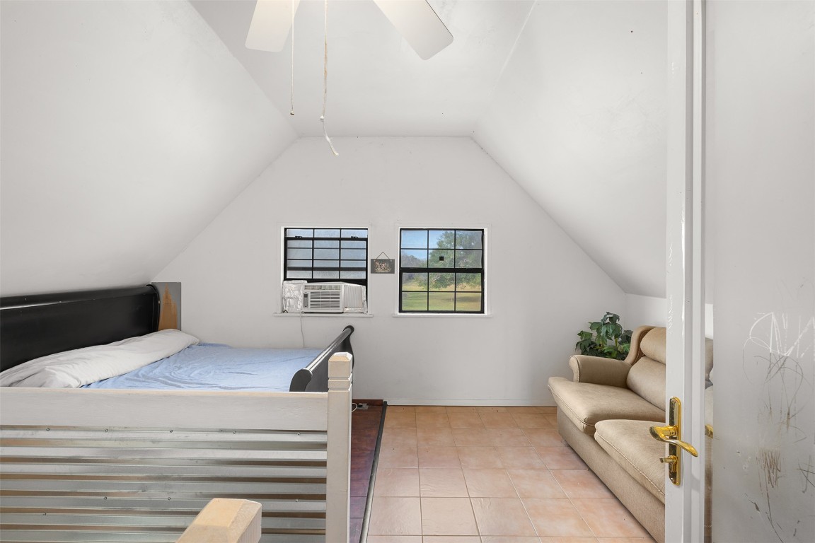 1820 South Old Smithville Road Flatonia, TX 78941 - Photo 13 of 33 a bedroom with a bed and a couch