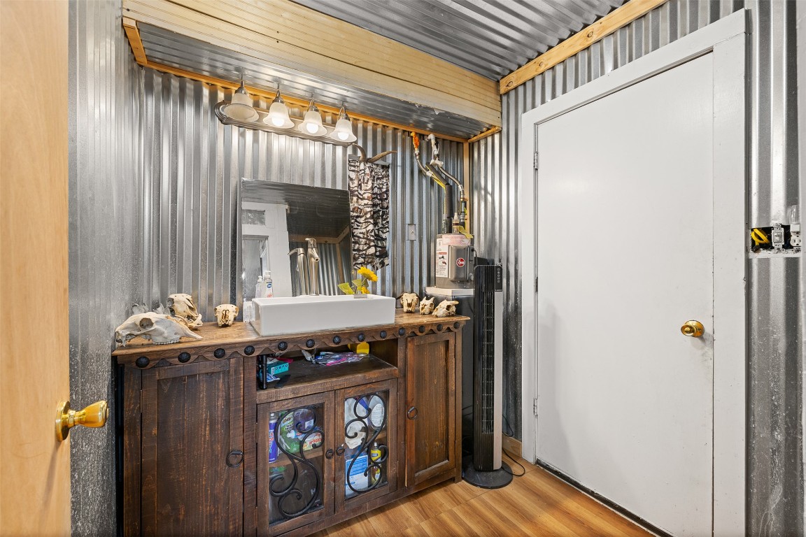 1820 South Old Smithville Road Flatonia, TX 78941 - Photo 14 of 33 a bath room with a sink and a window