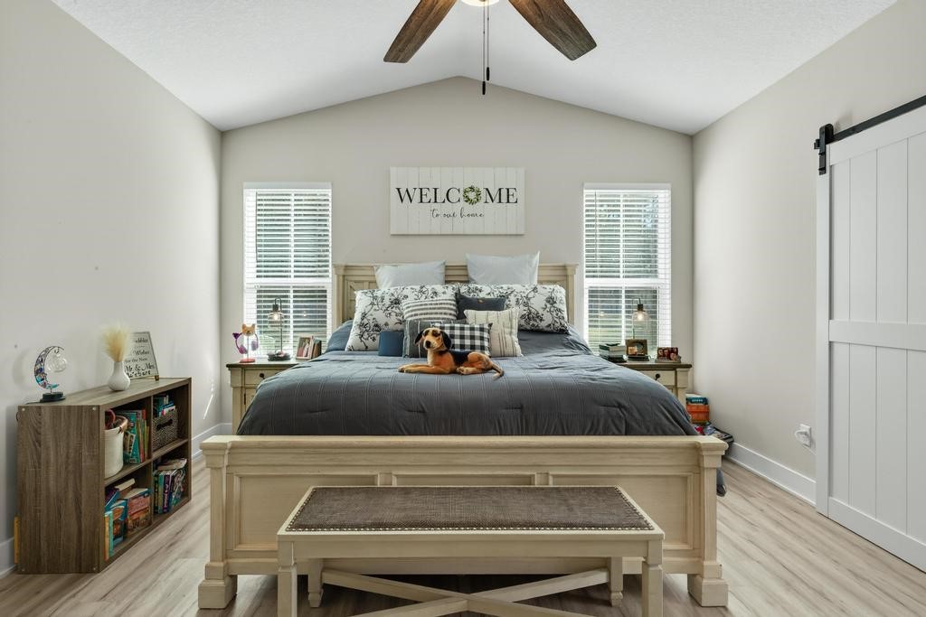 75774 Edwards Road Yulee, FL 32097 - Photo 40 of 70 a bed sitting in a room next to a window
