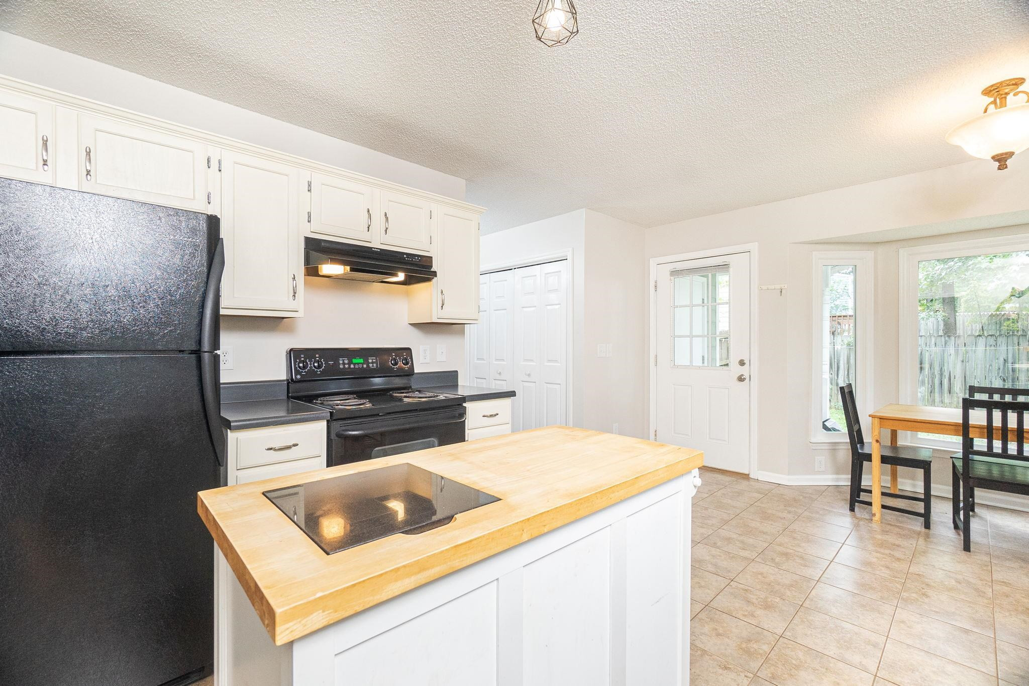 3659 Epperly Court Raleigh, NC 27616 - Photo 11 of 33 Refrigerator and Mobile Island Convey