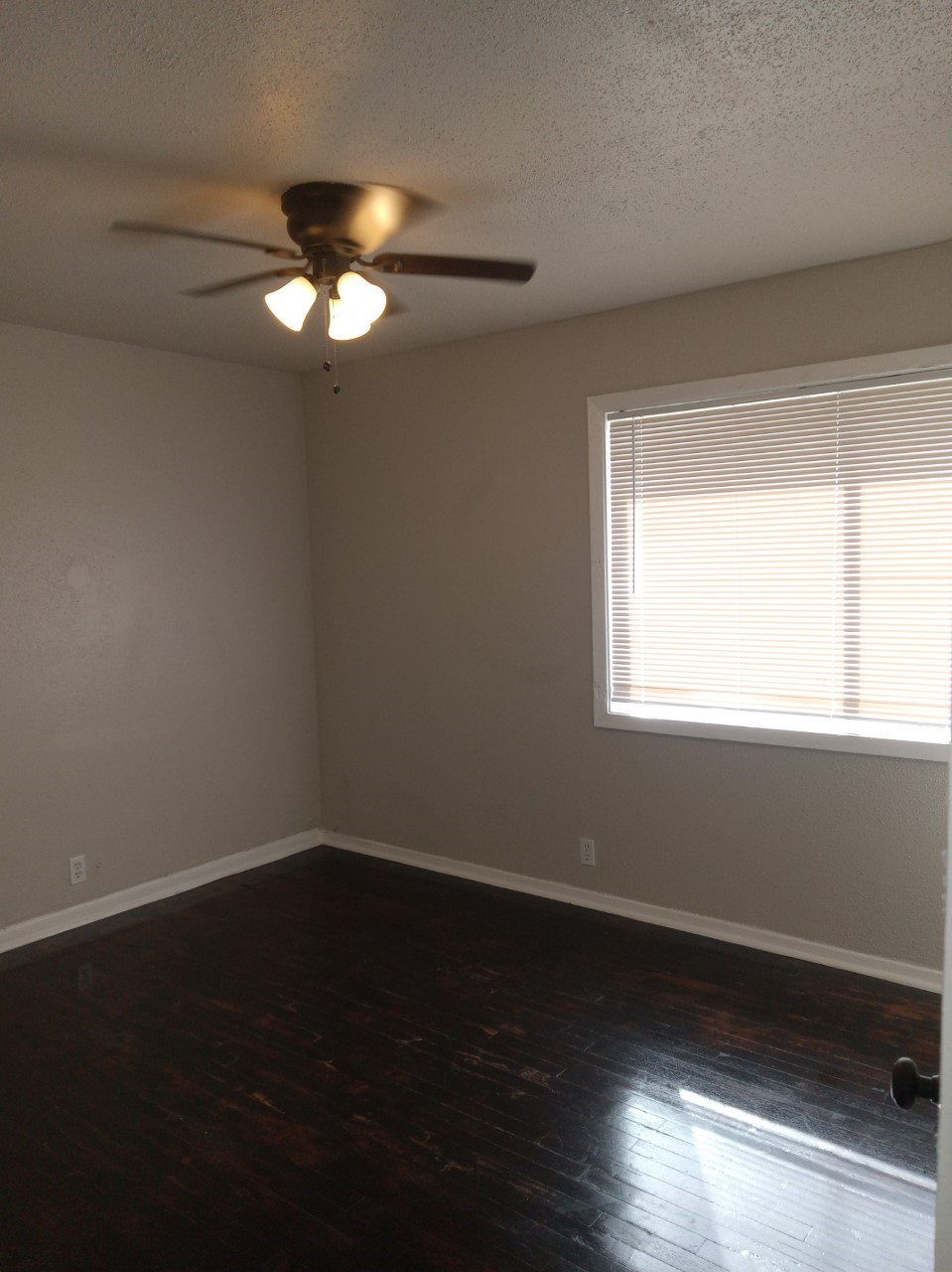 9306 St Lo Road Houston, TX 77033 - Photo 8 of 13 Bedroom with hardwood floors and new ceiling fan