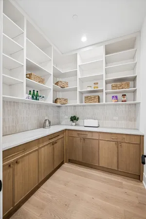 a kitchen with sink cabinets and window