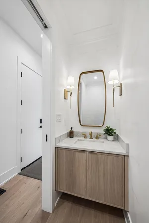 a bathroom with a double vanity sink and mirror