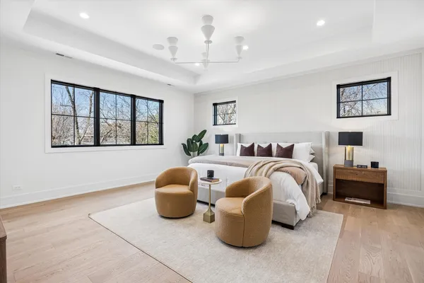 a spacious bedroom with a bed and window