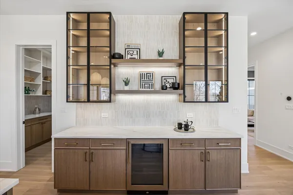 a kitchen with stainless steel appliances granite countertop a sink and a microwave