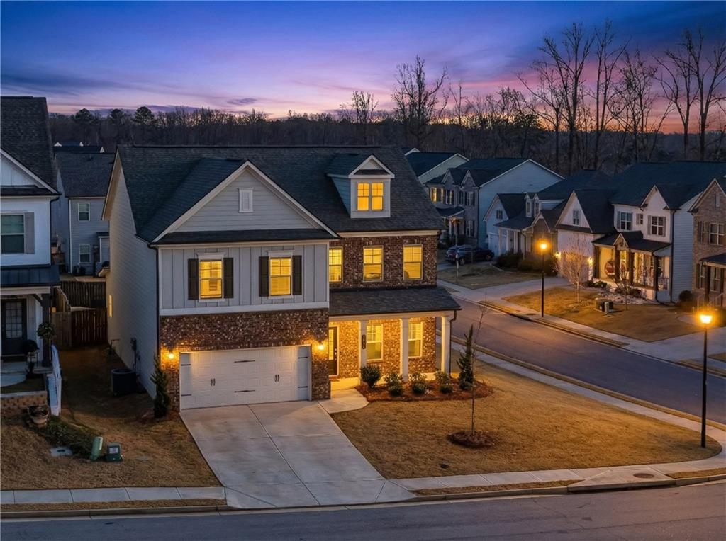 a front view of a house with a yard