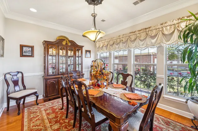 a bedroom with a bed dresser and a window