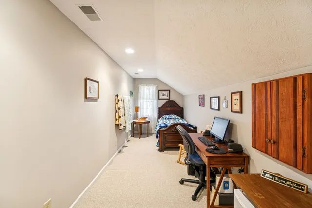 a dining room with furniture window and outside view