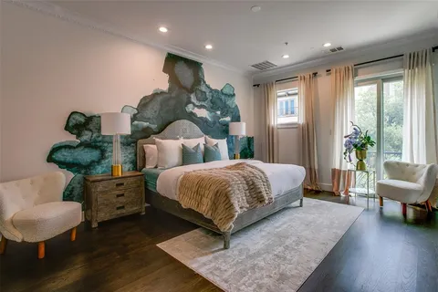 a spacious bedroom with a bed and a couch