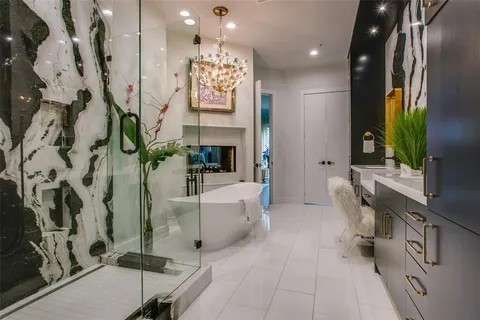 a spacious bathroom with a sink a mirror and a bathtub